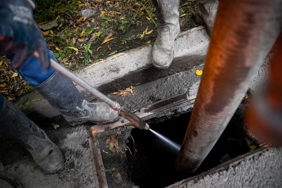 Drain & sewer services being performed